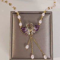 Collar colgante doble cisne morado