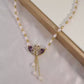 Collar colgante doble cisne morado